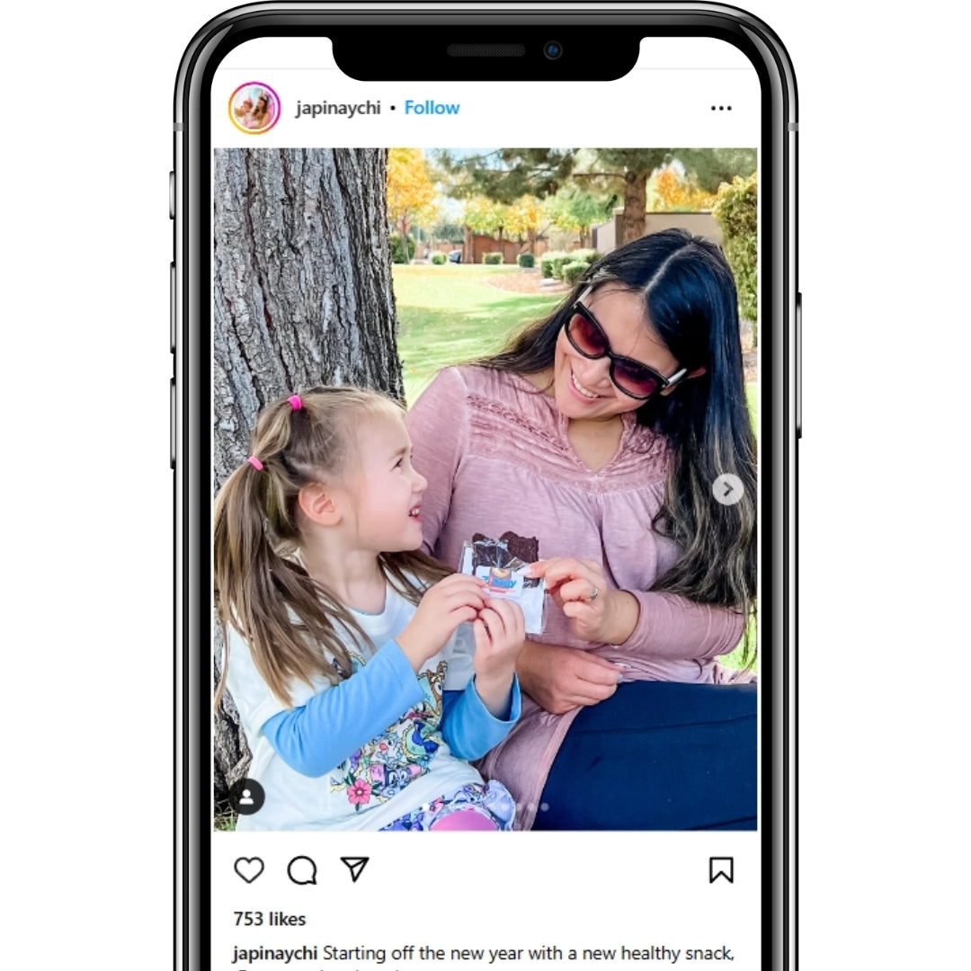 Instagram mother in child holding Ziggy Snack Bar