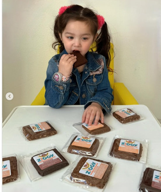 A girtl eating best snack bars from Ziggy Bars