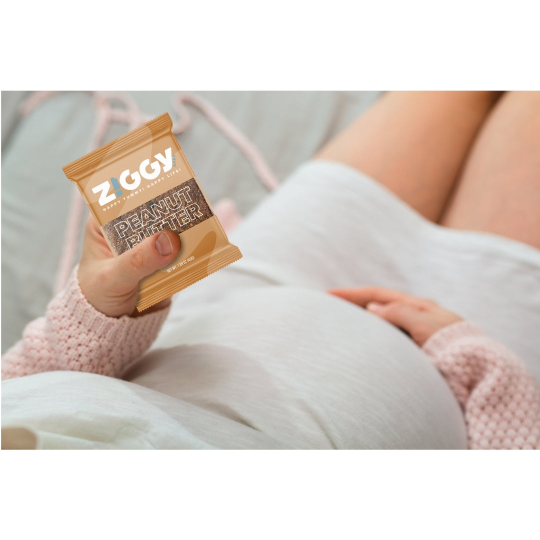 Woman holds Ziggy Snack Bars.